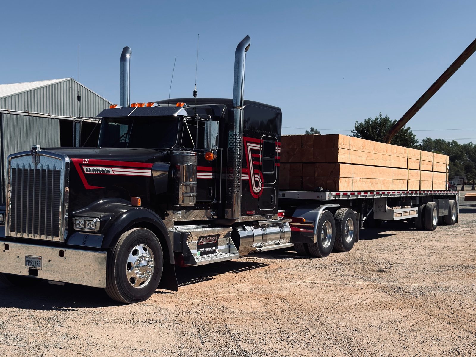 Kenworth with flatbed load of lumber